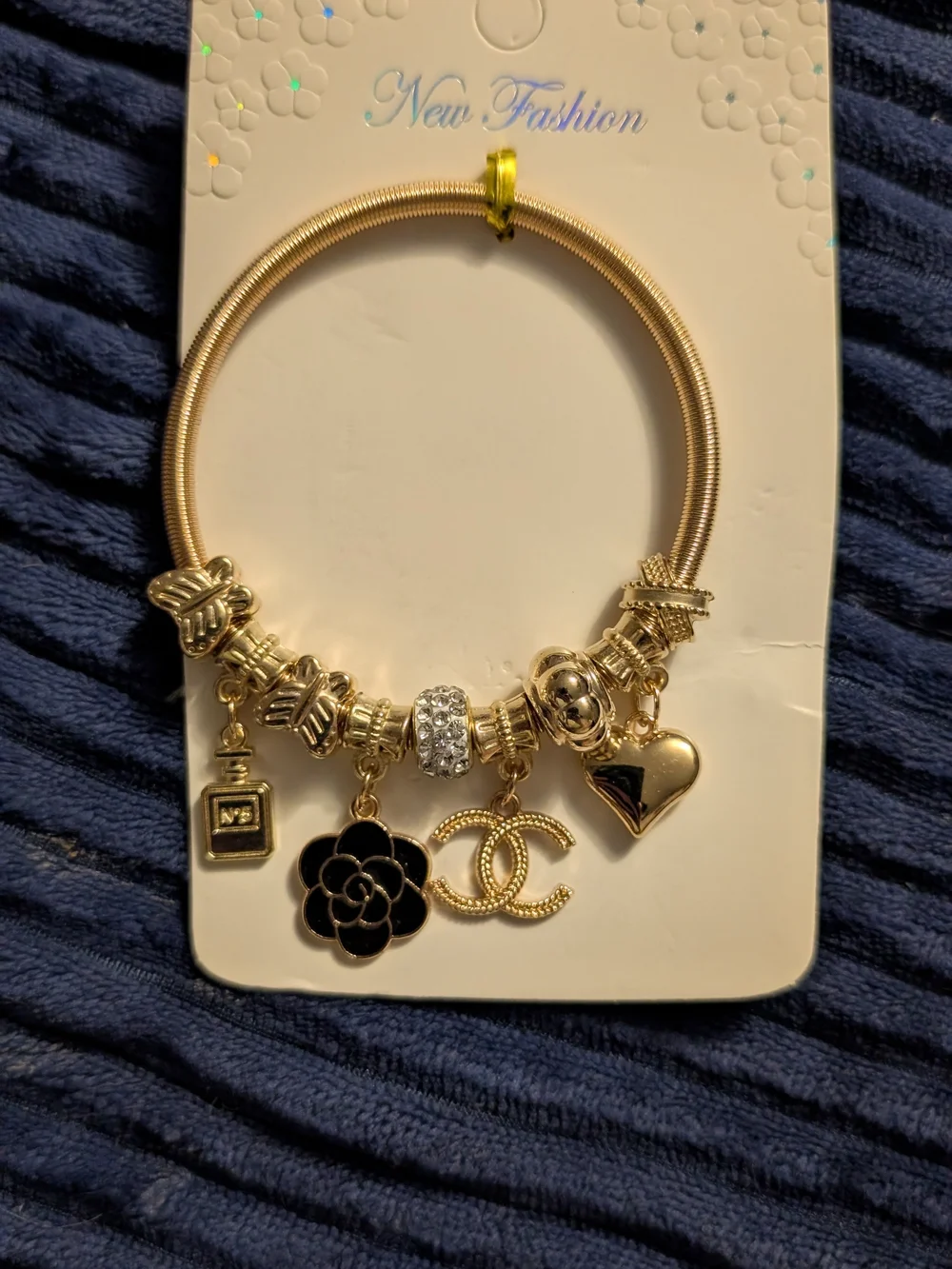 Gold Charm Bracelet with Black Flower and Heart Charms